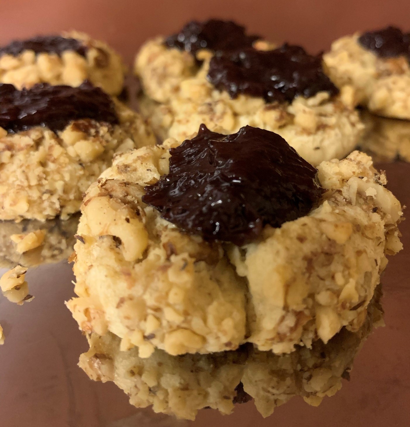 "Thumbprint cookies with crushed walnuts and blueberry jam"